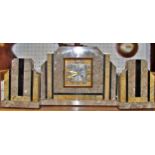 A continental polished marble mantle clock garniture, in the Art Deco style (3)