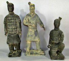 Three Black Terracotta Soldiers, souvenirs from the tomb of Qin Shi Huang in Xian China.