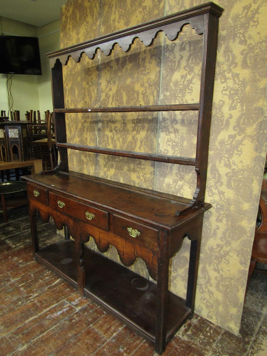 An early Georgian oak cottage pot-board dresser incorporating three drawers with plate rack above, - Image 3 of 3