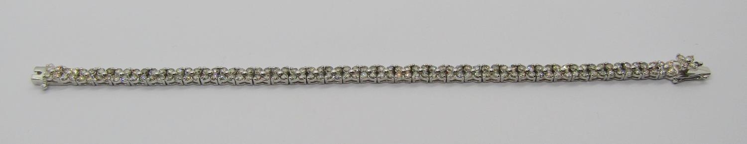 18k white gold diamond quatrefoil cluster line bracelet, 5ct total approx, 17.3cm L approx, 13.3g