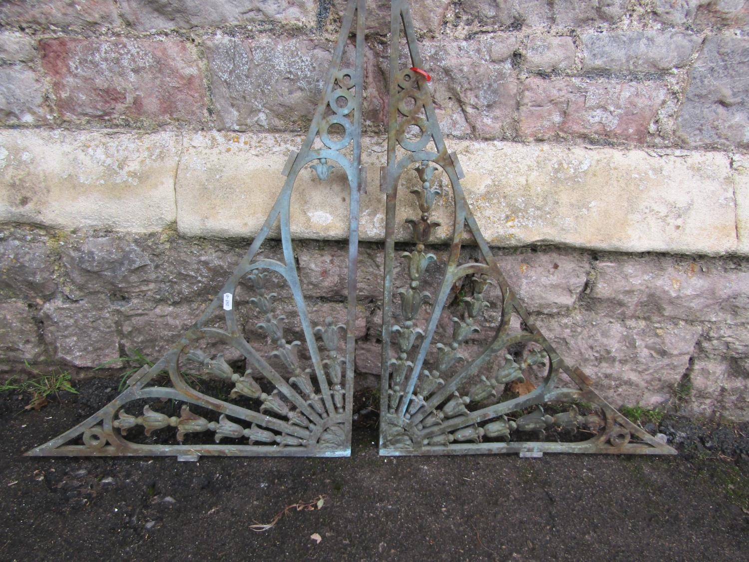 A pair of reclaimed 19th century cast bronze architectural brackets with trailing harebell and