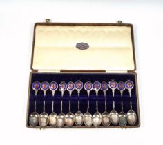 Edwardian set of 12 silver and enamel coffee spoons, each with crossed rifle and "Defence M D R C"