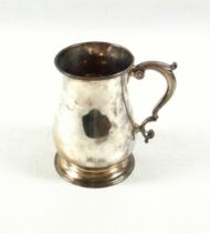 George II silver pint mug of baluster form with a twin scroll handle and thumbpiece, by William Shaw