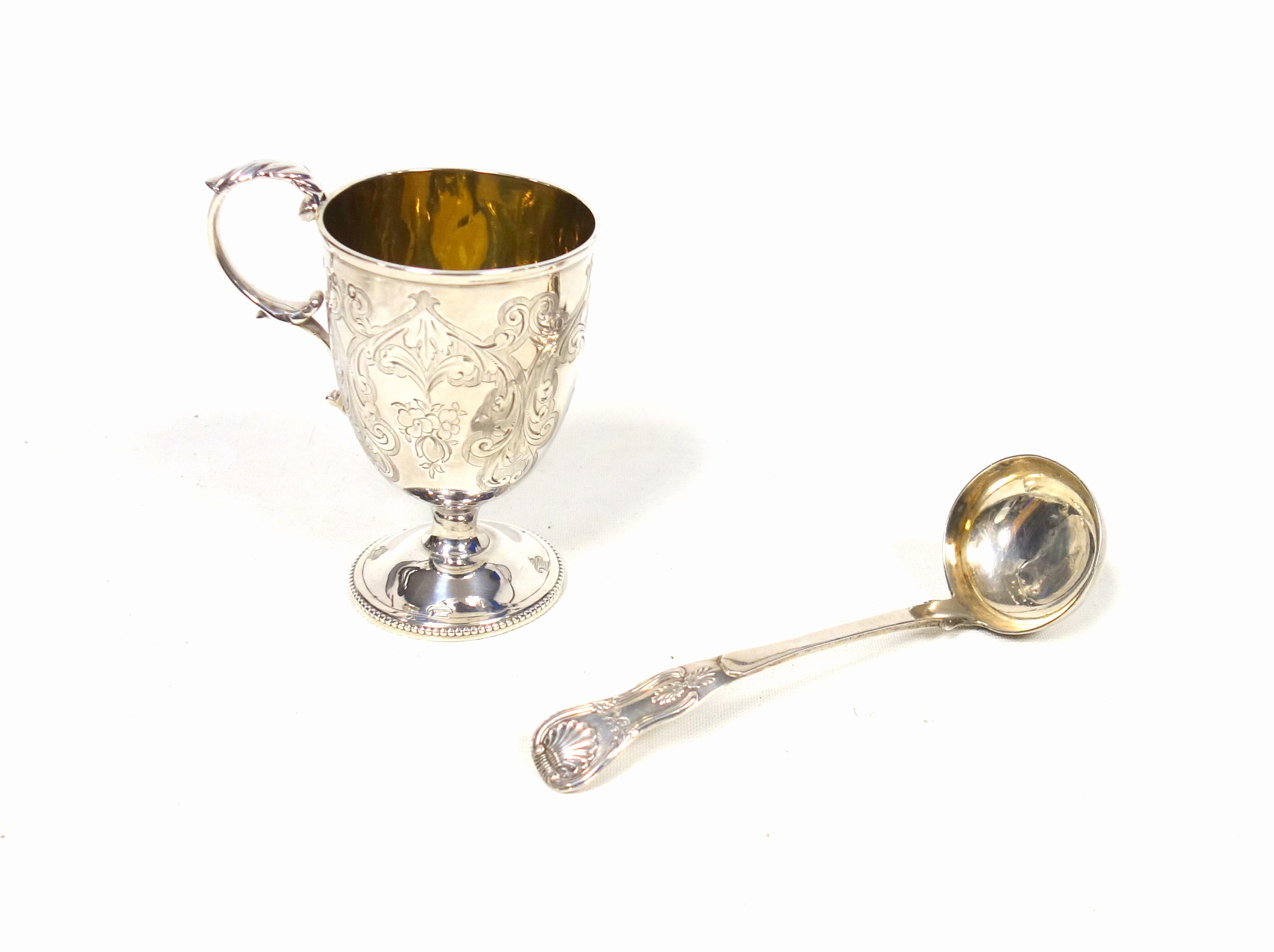 Victorian silver pedestal christening mug with all-over chased floral decoration initialled "N",
