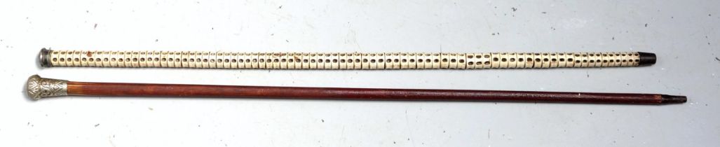 Victorian vertebrae cane with a plated domed handle, L.86.5cm, and a military hardwood cane, the