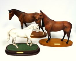 Three Royal Doulton models of race horses: 'Arkle', 30cm high; 'Troy', 28cm high; and 'Desert