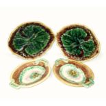 Two late 19th/early 20th century majolica leaf-form footed serving dishes moulded with a single
