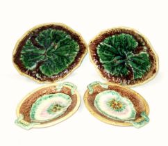 Two late 19th/early 20th century majolica leaf-form footed serving dishes moulded with a single