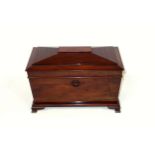 Victorian mahogany tea caddy of sarcophagus form, the interior with 2 removable boxes flanking a