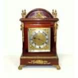 Edwardian Regency style mantel clock with a brass dial, silvered chapter ring and Roman numerals