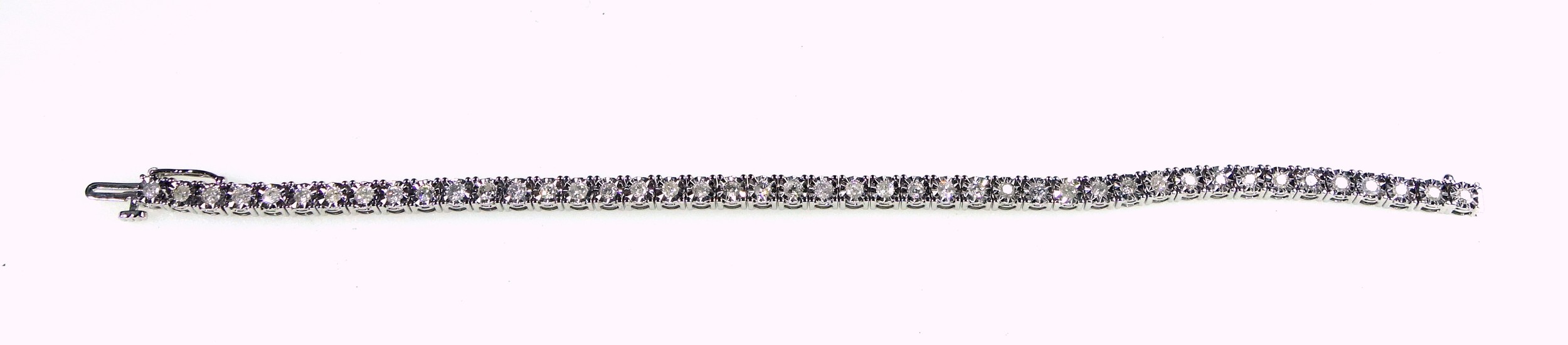 9ct white gold tennis bracelet with 44 illusion set diamonds, L.18.3cm, gross 11.9grs, cased. (2) - Image 2 of 4