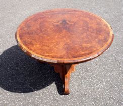 19th Century Austrian figured walnut breakfast table, the tilting circular top with a rosewood and