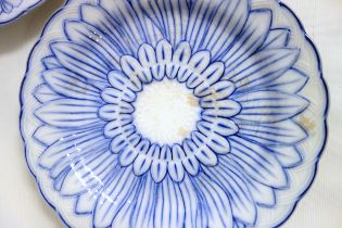 Six Wedgwood sunflower plates in blue and white, 19th century, the underside impressed 'WEDGWOOD'