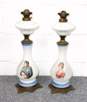 Pair of French opaline glass oil lamps, each with a portrait of Napoleon or Josephine, H.57cm. (2)