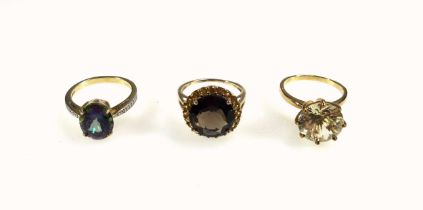 9ct gold ring set purple green stone and brilliants, 9ct citrine ring, and a 9ct smokey quartz