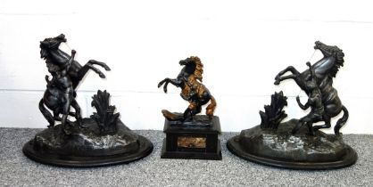 Pair of spelter Marly horse groups, each on an oval wood base, H.35cm, and a smaller group, H.