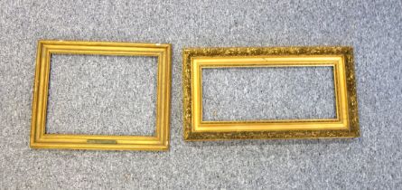 Gilt moulded rectangular picture frame with foliate and rococo decoration, rebate 52.7 x 22.7cm,