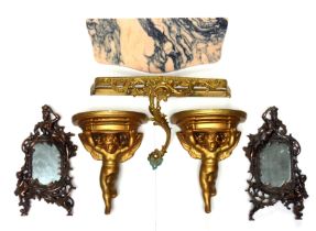 Pair of Italian gilt plaster cherub wall brackets, each with a semi circular top, 29.5 x 23.5cm;