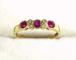 18k gold, ruby and diamond ring, size Q 1/2, set three rubies and four small diamonds, 2.4 grams