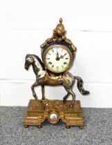 Italian Louis XVI style silvered and gilt metal mantel clock with a circular enamelled dial