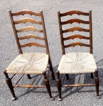 Pair of 2 Edwardian Yorkshire style beech chairs, each with a ladder back and seagrass seat