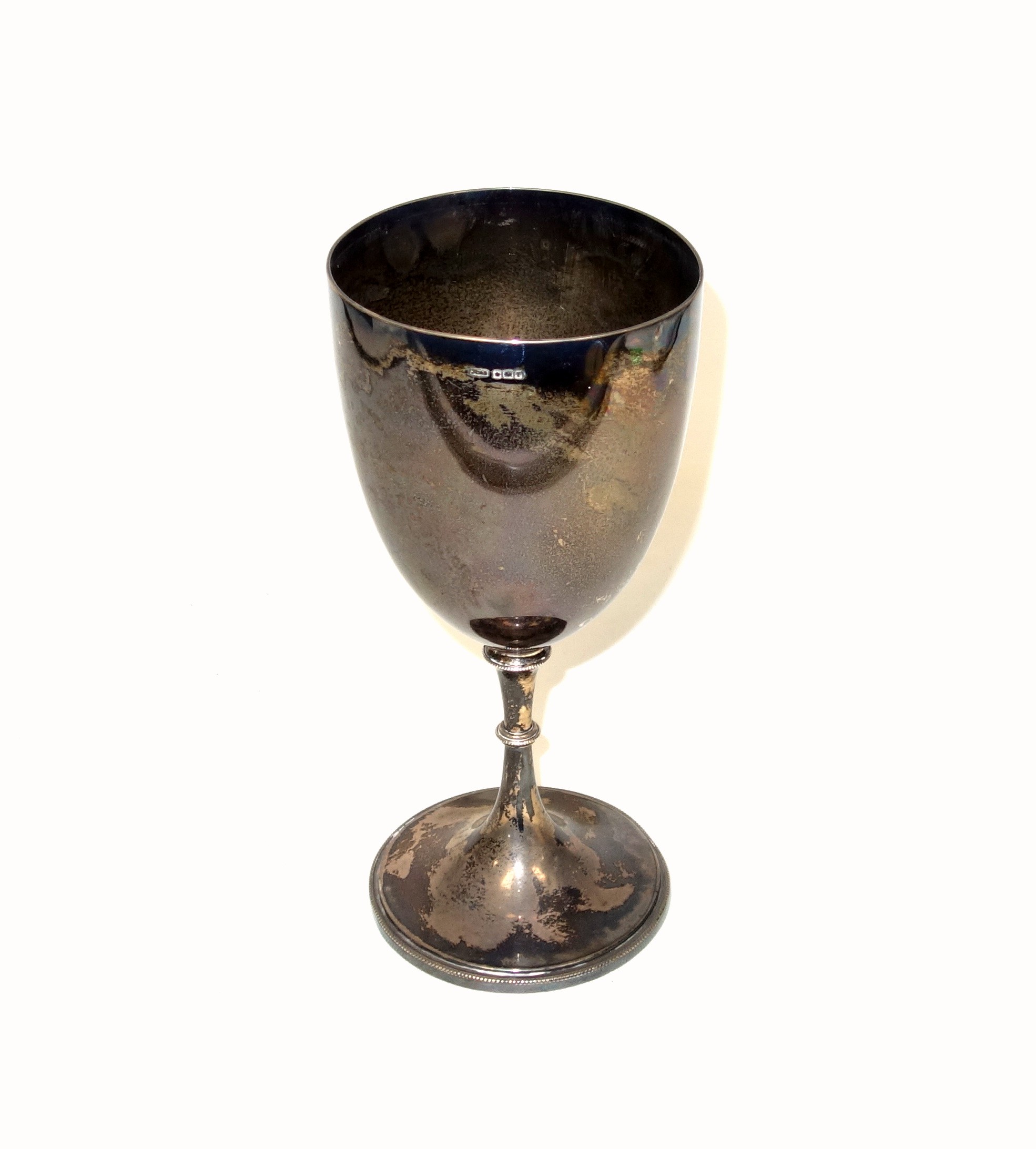 Large Edwardian silver goblet, of plain form with a beaded knopped stem and circular foot, by