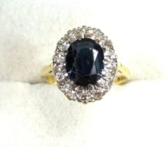 18ct gold ring set sapphire within a band of 14 illusion sapphires, size M, London, 1968, 3.9grs