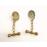 Pair of 18ct gold oval cufflinks, each engraved with a monogram, 11grs. (2)