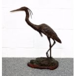 Late 19th Century French bronze model of a heron after Anthony, standing on a rocky base and wood