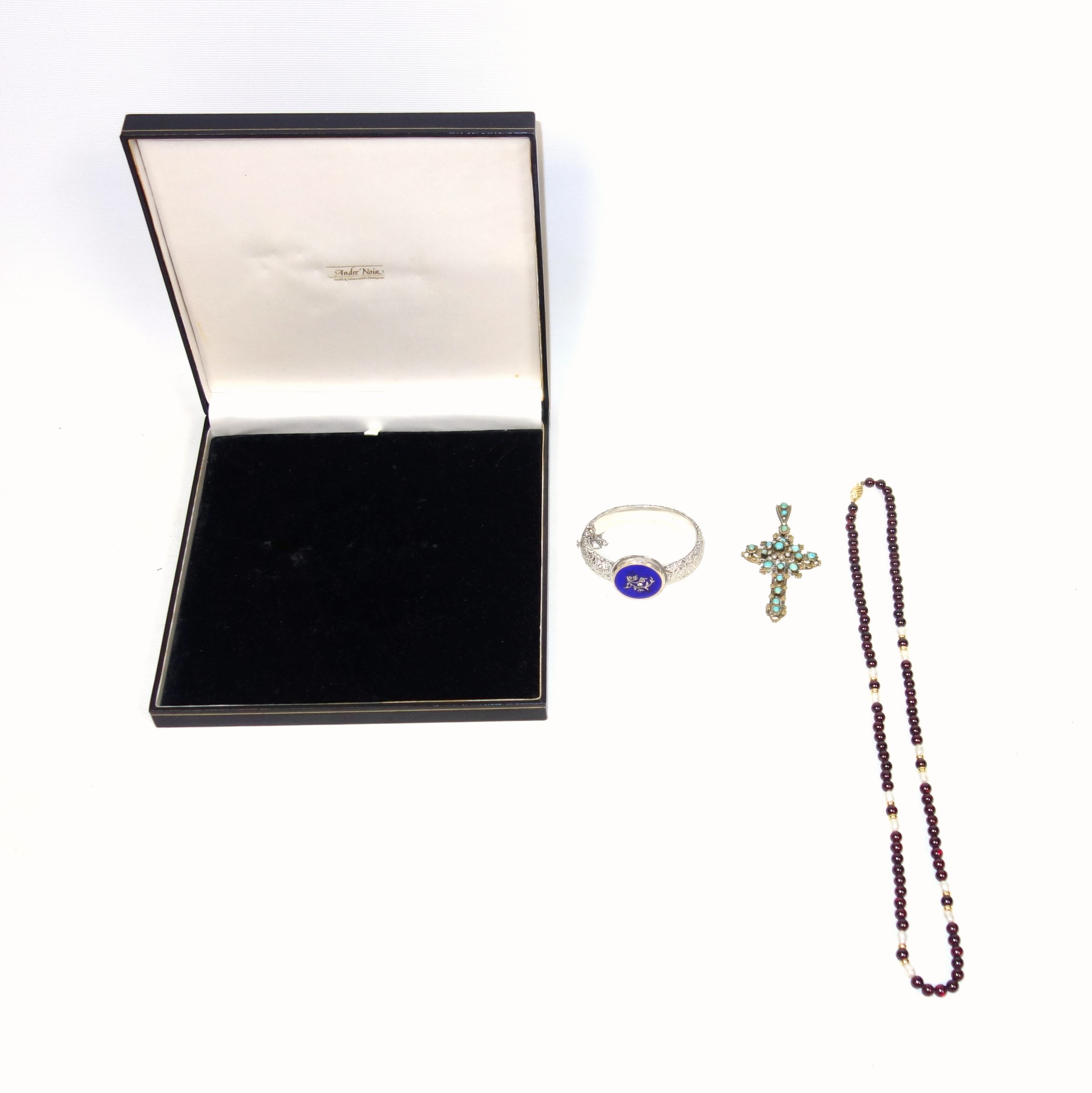 Purple and mother-of-pearl bead necklace with a clasp stamped "750", L.61cm, cased; Eastern