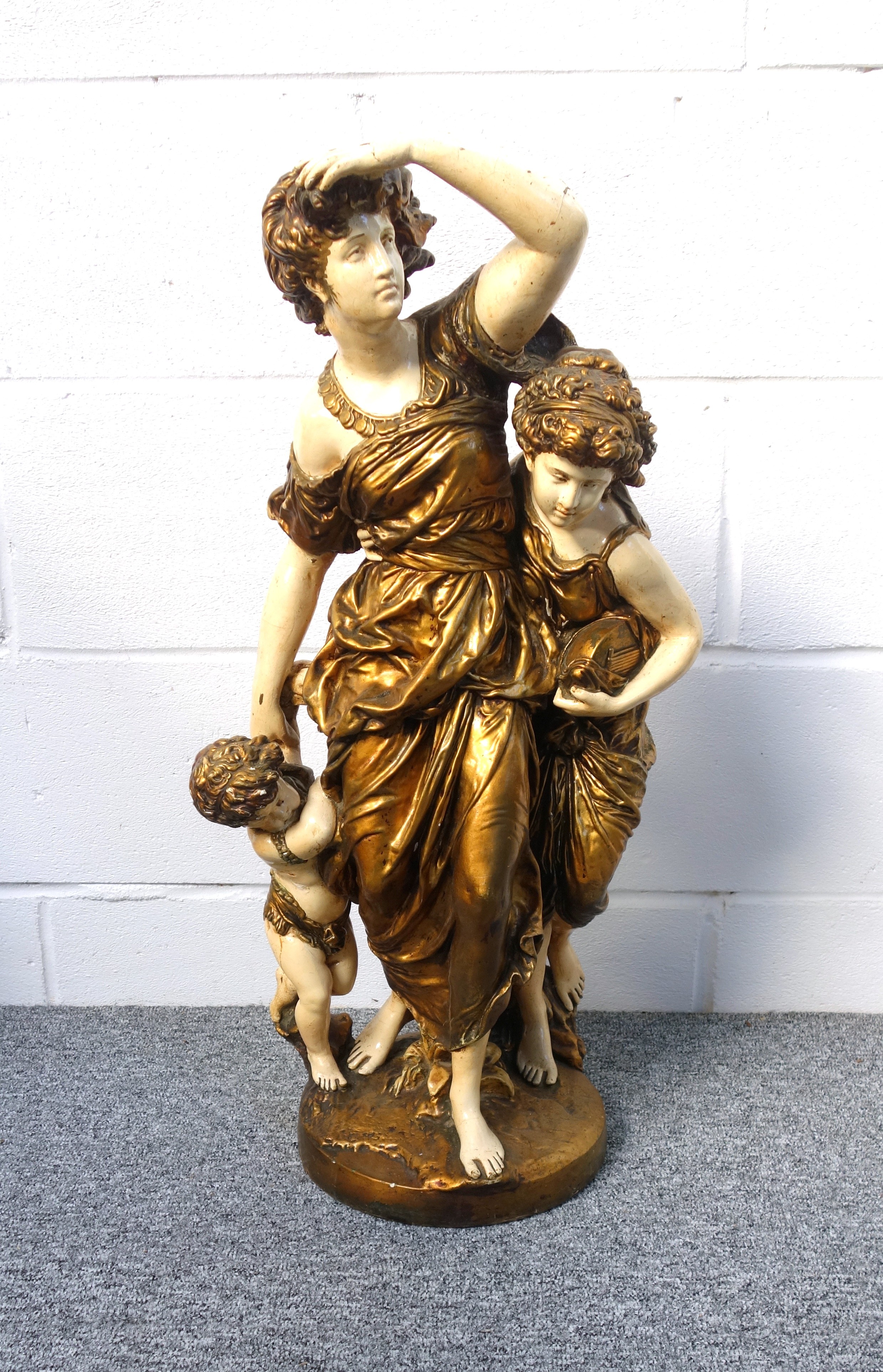 Late 19th Century Austrian plaster group of a woman with two children wearing gold costume, standing