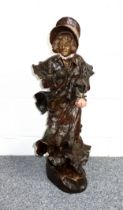 Late 19th Century Goldscheider bronzed earthenware figure of a woman wearing floral draped costume
