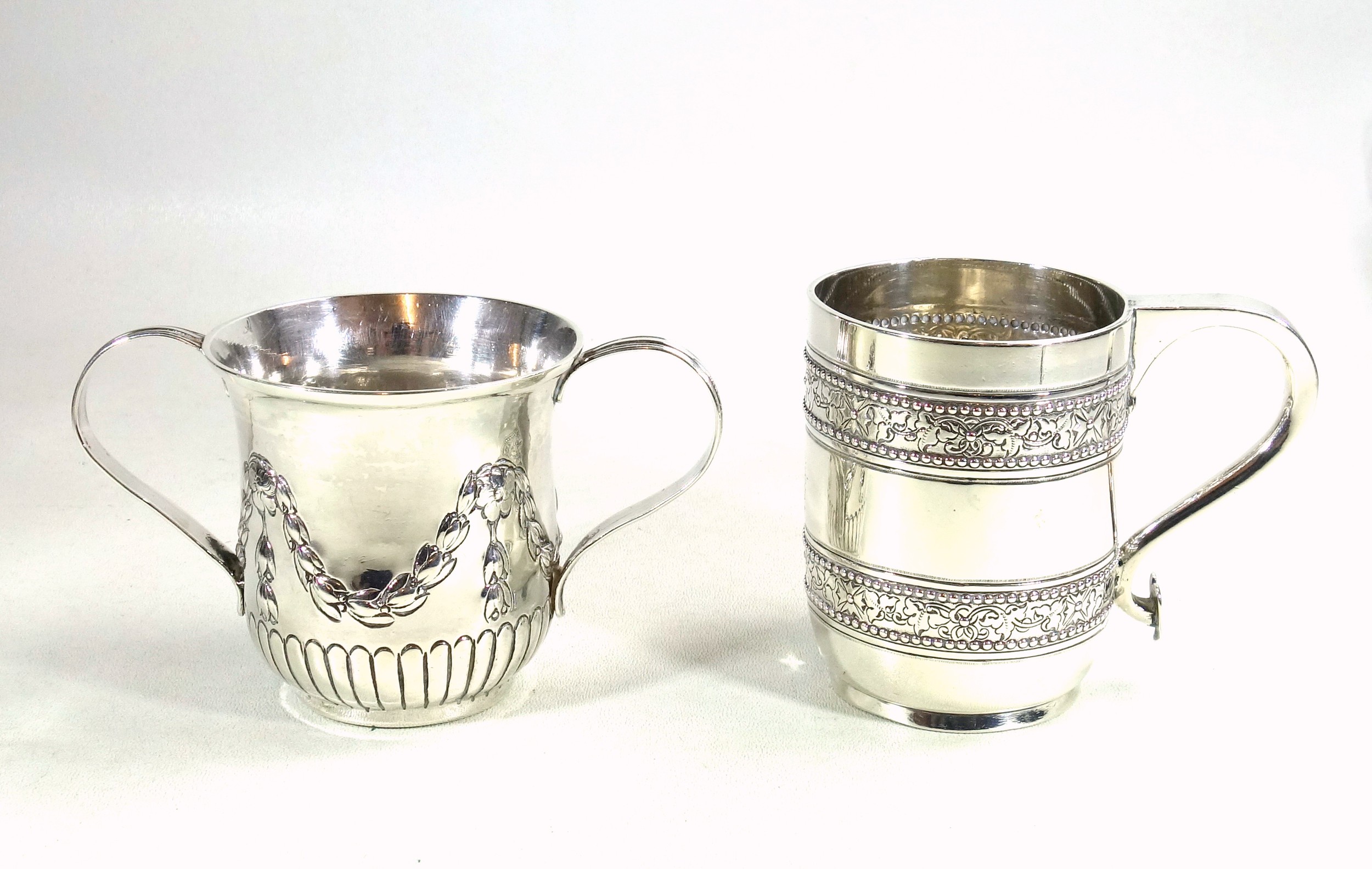 George III silver porringer with reeded twin strap handles, semi reeded body and embossed swag