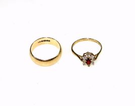9ct gold wedding band, ring size M 1/2, 3.7 grams and a 9ct gold CZ and garnet ring, size N 1/2, 1.6