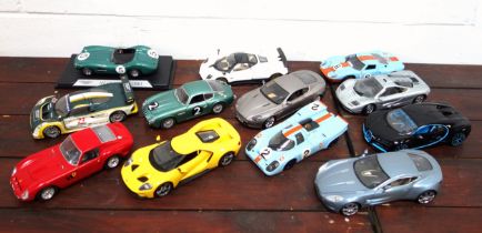 Twelve 1:18 scale diecast models of sports cars, including Burago Ferrari GTO and Bugatti Chiron;