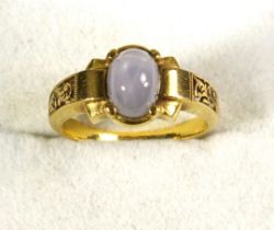 Yellow metal dress ring set cabochon cut star sapphire, size P, with floral pierced panel shoulders,