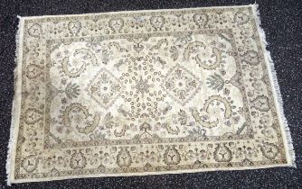 Eastern rug, the ivory field with lozenges and all-over stylised floral decoration, 270 x 183cm, (