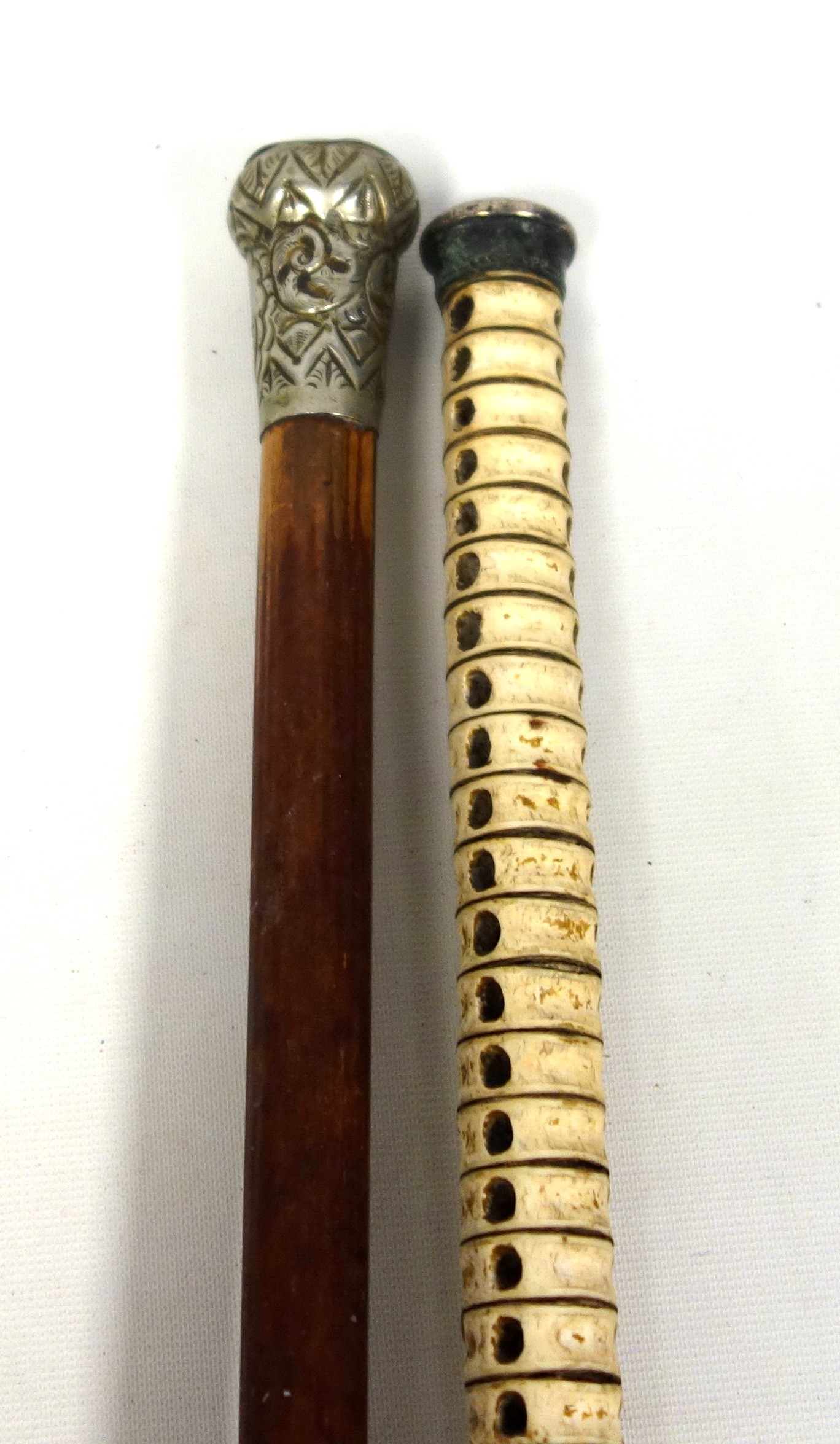 Victorian vertebrae cane with a plated domed handle, L.86.5cm, and a military hardwood cane, the - Image 2 of 4