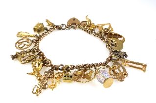 9ct gold charm bracelet with 27 charms, gross weight 44.2 grams