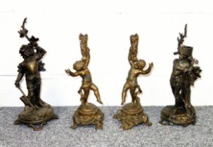 Late 19th Century French bronzed spelter candlesticks, each with a figure of a soldier, standing