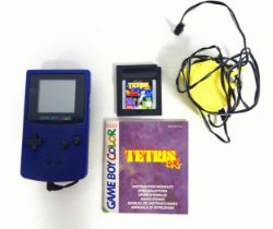 Game Boy Color with charger and Tetris game.