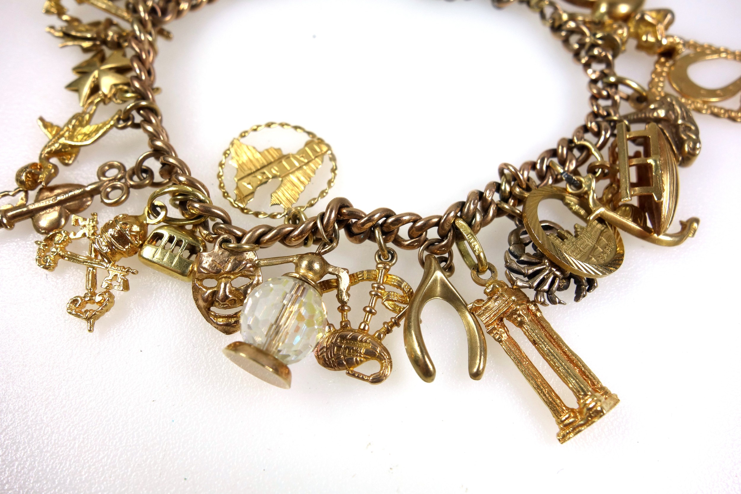 9ct gold charm bracelet with 27 charms, gross weight 44.2 grams - Image 4 of 5