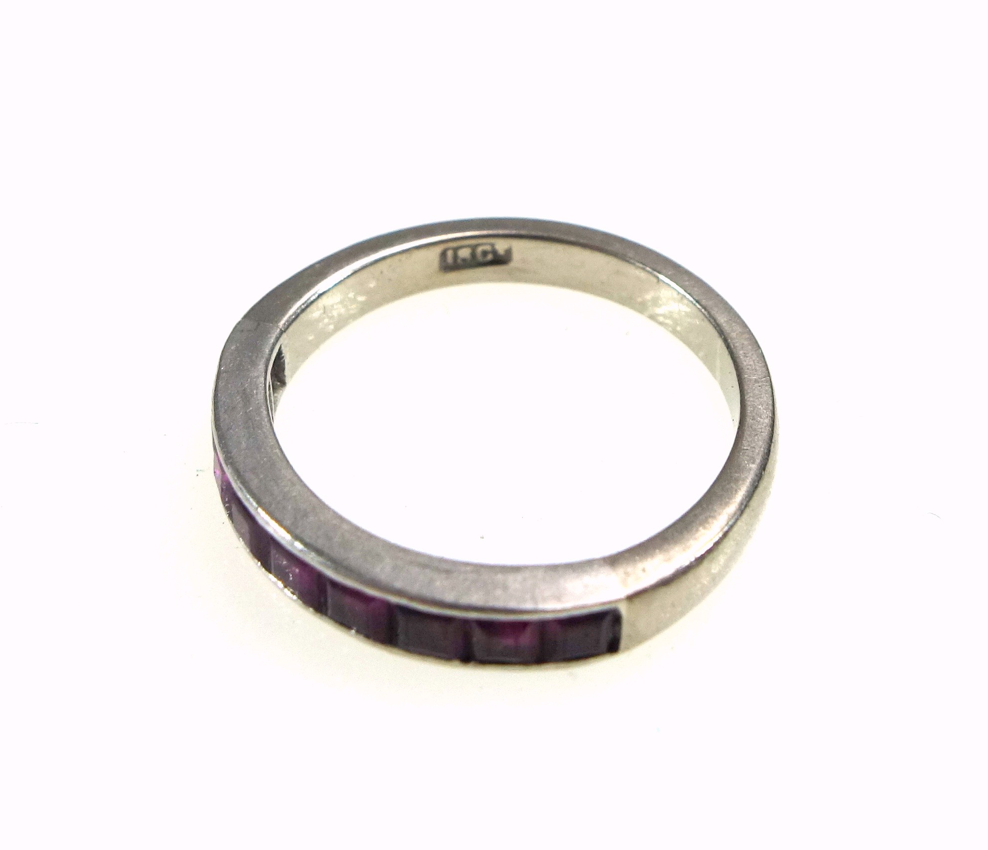 White metal 1/2 eternity ring set 9 rubies, stamped "18ct", 3.7grs - Image 2 of 2