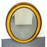 Edwardian wall mirror with an upright bevelled oval plate, in a gilt moulded frame, 86 x 60.5cm