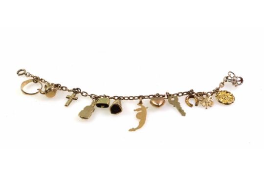 Yellow metal bracelet with 13 various charms, marked "375", gross 12.7grs - Image 2 of 3