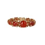 An 18-kt gold bracelet, set with carnelian cabochons and brilliant cut diamonds, in total approx. 0.