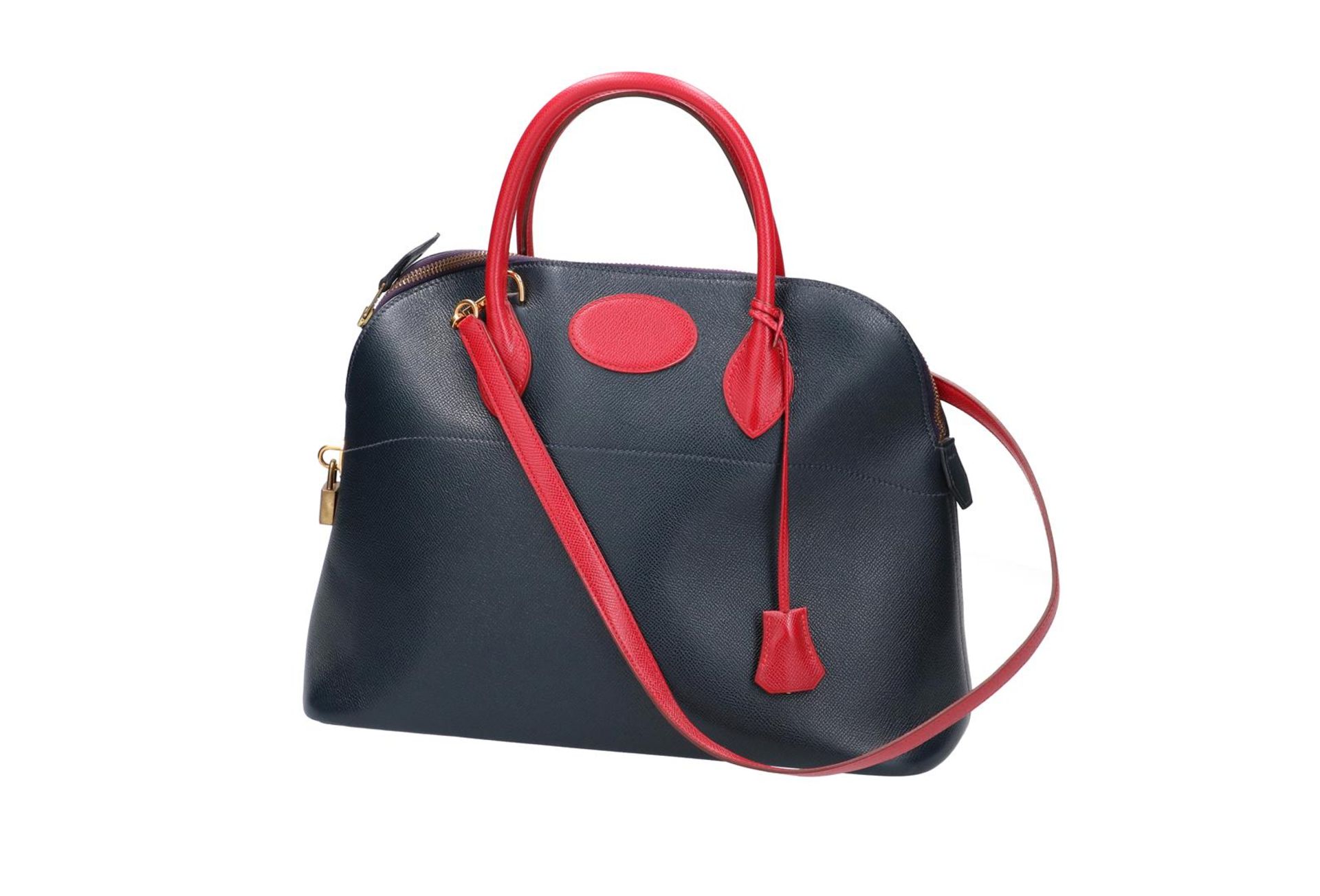 Hermes, navy blue and red handbag, 'Bolide', with lock and two keys. H x W x D: 28 x 34 x 14 cm.