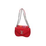 Louis Vuitton, red calf leather handbag, 'New Wave', with booklet. H x W x D: 21 x 13 x 6.5 cm.