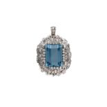 A white gold pendant, set with an emerald cut aquamarine of approx. 46.48 ct. and an entourage of br