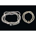 An Opera cultered pearl necklace with 14-kt white gold clasp set with cultured pearls and sapphire,